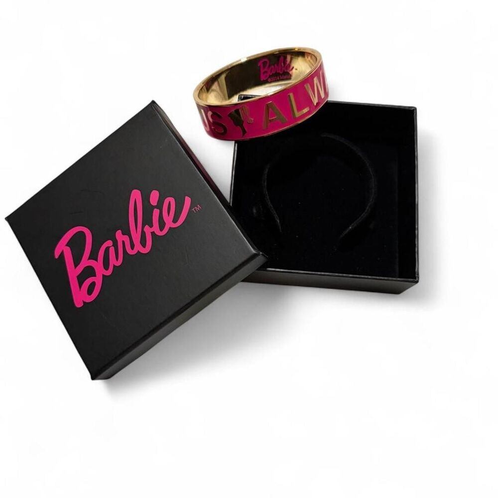 Adult sized Barbie with pink band and gold lettering reading 'ALWAYS FABULOUS'